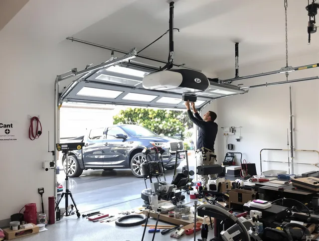 Lawndale Garage Door Repair specialist installing smart garage door opener system in Lawndale home