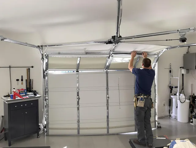 Lawndale Garage Door Repair specialist performing precise section replacement on Lawndale garage door